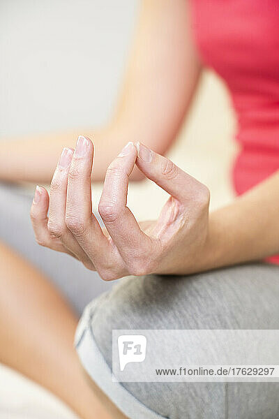 Close-up of woman's hands during a meditation session.