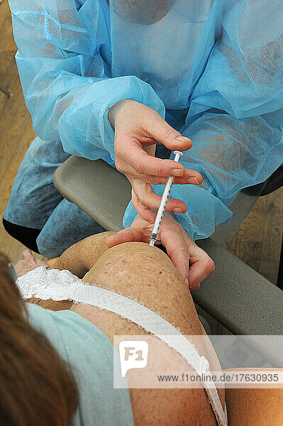 Nurse injecting covid-19 vaccine. Covid 19 vaccination center in Abbeville (80)  Pfizer vaccine.