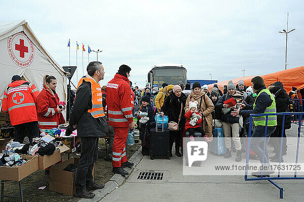 Isaccea border post - Romania. Reception of Ukrainian refugees by the Romanian Red Cross. Distribution of hot drinks  food  stuffed animals  clothing  diapers  medicines