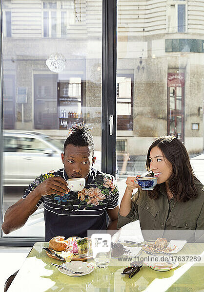 Couple enjoying breakfast in restaurant