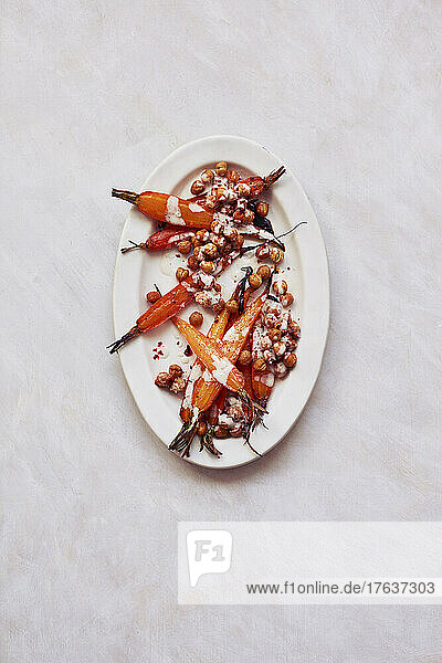 Overhead view of baked carrots on plate