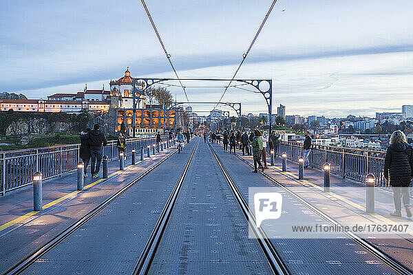 Portugal  Porto  Pedestrians on Dom Luis I Bridge at dusk