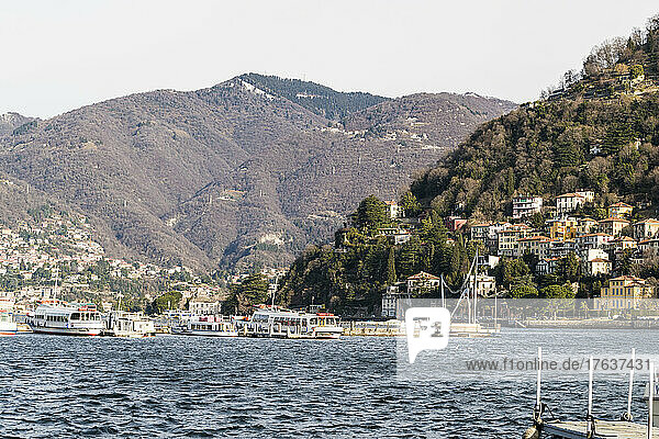 Italy  Como  Ferries on lake Como and town on hillside