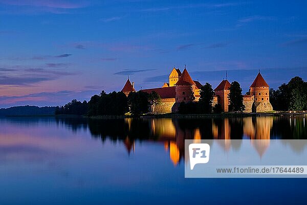 Night view of Trakai Island Castle in lake Galve illuminated in the evening  Lithuania