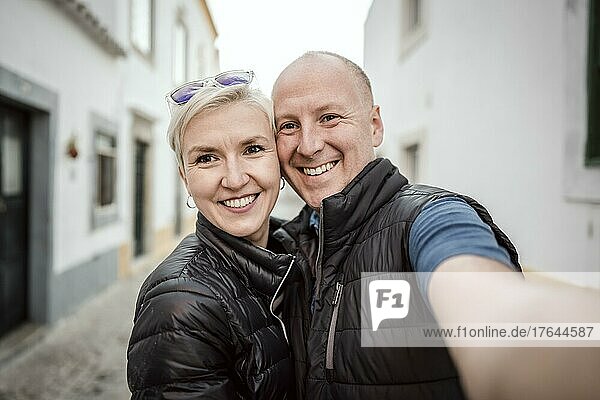A selfie photo of a couple enjoying vacation in south Europe  Faro  Portugal  Europe