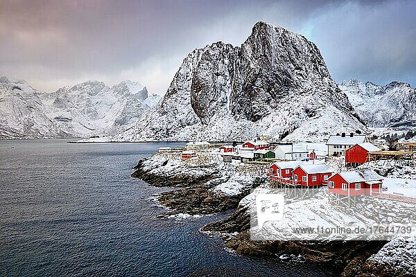 Famous tourist attraction Hamnoy fishing village on Lofoten Islands  Norway with red rorbu houses in winter