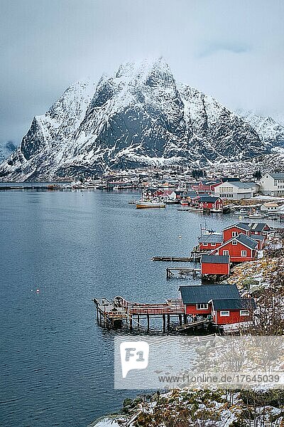 Reine fishing village on Lofoten islands with red rorbu houses in winter with snow. Lofoten islands  Norway