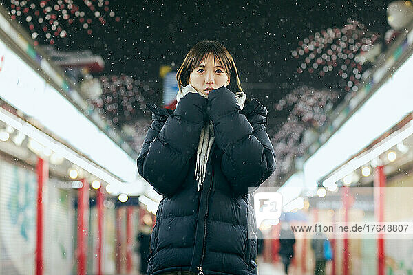 Portrait of young Japanese woman in the snow