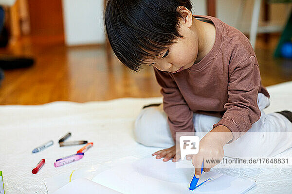 Japanese kid playing at home