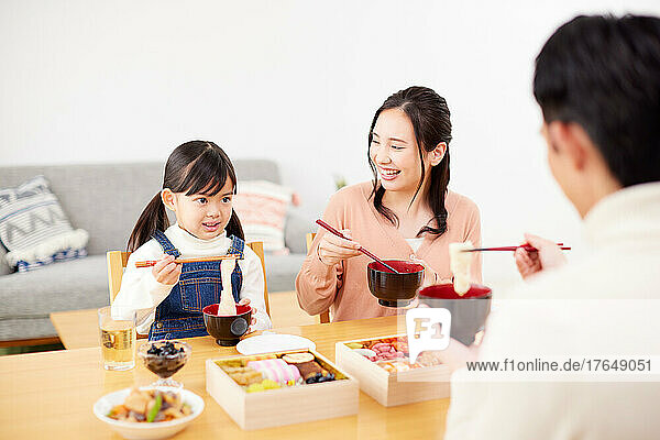 Japanese family eating together at home