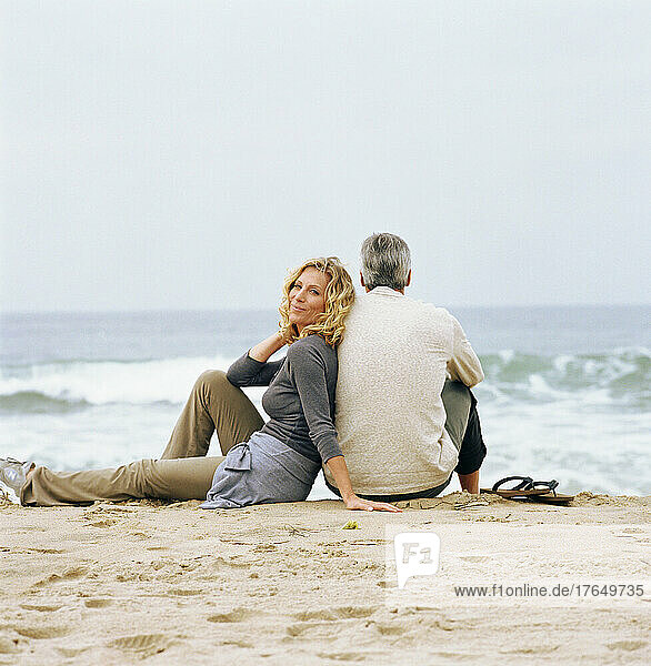 Couple relaxing on beach
