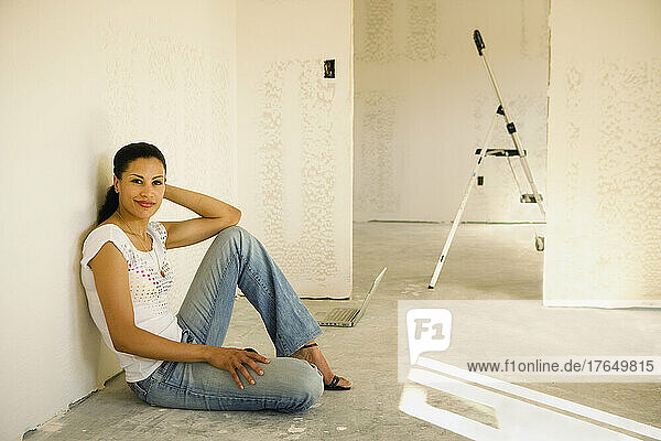 Young woman during house renovation