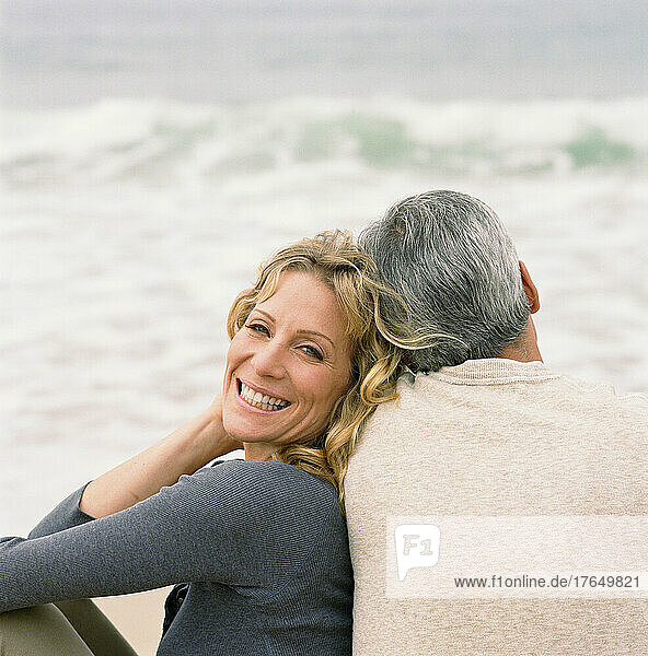 Couple sitting on beach