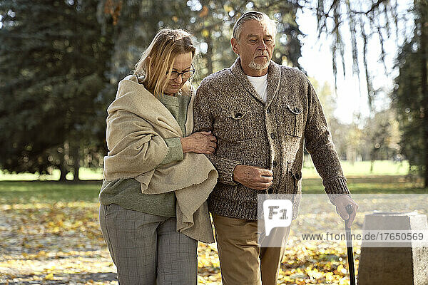 Senior couple walking at public park
