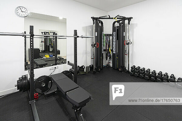Exercise equipment and dumbbells in empty health club