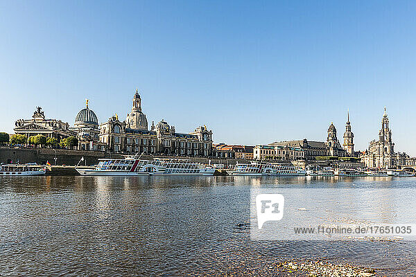 Germany  Saxony  Dresden  Elbe river with moored tourboats and Dresden Academy of Fine Arts in background