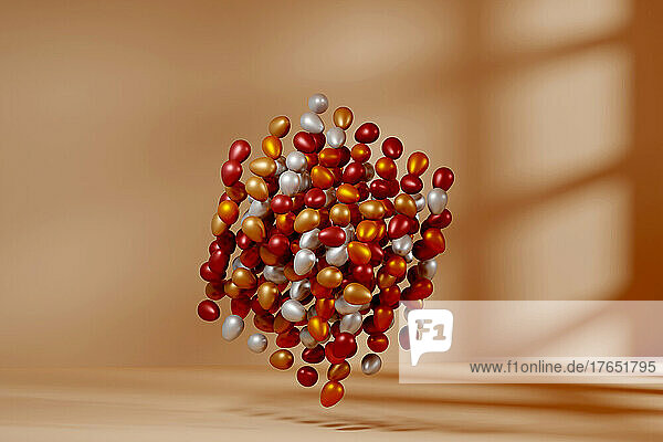 Three dimensional render of floating cube made of metallic eggs