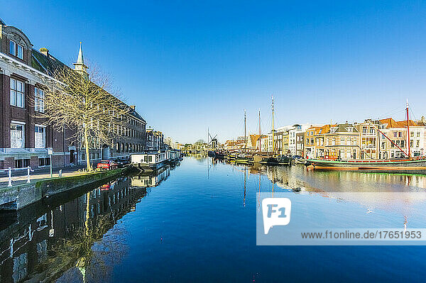 Netherlands  South Holland  Leiden  Clear blue sky reflecting in city canal