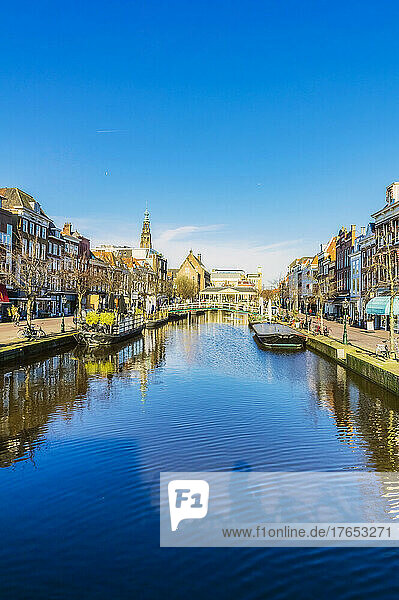 Netherlands  South Holland  Leiden  Clear blue sky reflecting in city canal