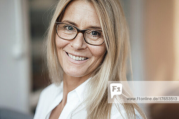 Smiling mature woman with eyeglasses