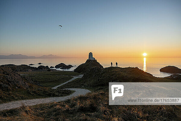 UK  Wales  Newborough  Winding footpath leading to Twr Mawr Lighthouse at sunset