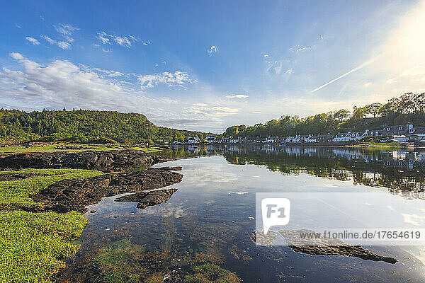 Picturesque Plockton village reflecting on lake  Scotland