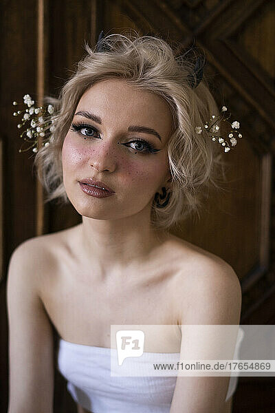 Beautiful young woman with blond hair and make-up