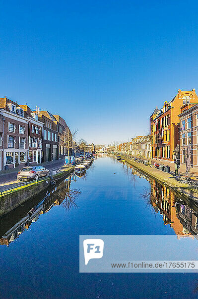 Netherlands  South Holland  Leiden  Clear blue sky reflecting in city canal