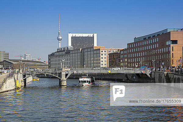 Germany  Berlin  Bridge stretching over river Spree with buildings of Mitte district in background