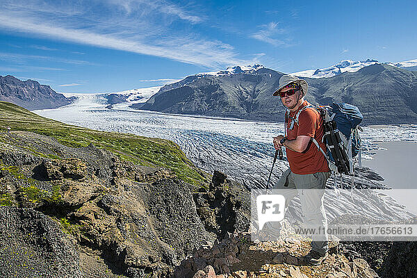 man hiking high above the Skaftafell glacier in south Iceland