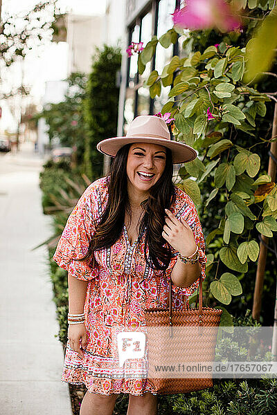 Mid 30's Hispanic Woman Modeling Clothing & Laughing in San Diego