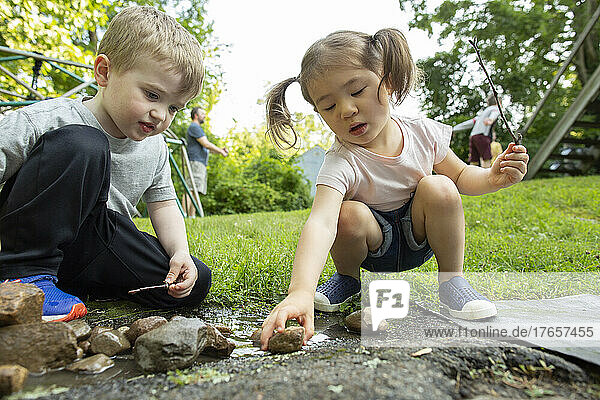 Kids Engaging in Creative Free Play Outdoors in Backyard