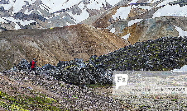 photographer taking pictures of the volcanic landscape in Iceland