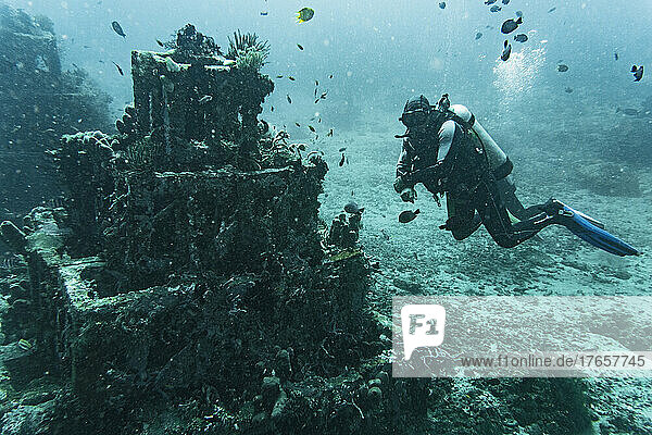 diver exploring underwater structure in Bali