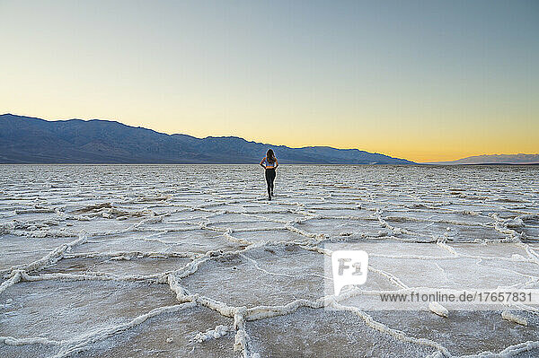 Female walking at Badwater in Death Valley National Park