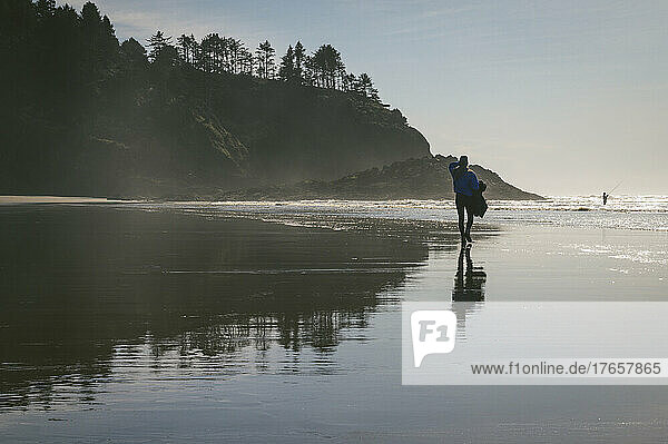Female walking down the beach on The Washington Coast