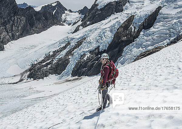 A woman walks down the Blue Glacier on Mount Olympus