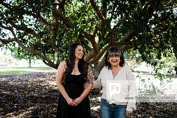 Mother & Daughter Standing Together at Park in San Diego