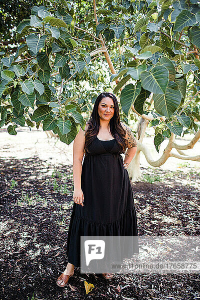 Late 30's Mexican Woman in Black Dress at Park in San Diego