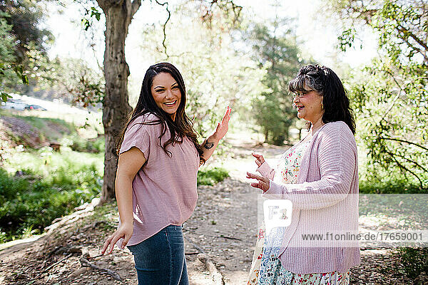 Mother & Daughter Dancing at Park in San Diego