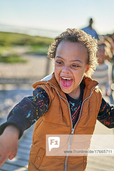 Happy, playful boy with Down Syndrome