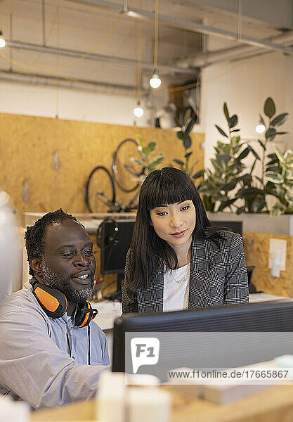 Business people working at computer in office