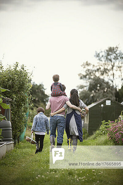 Affectionate family walking in garden