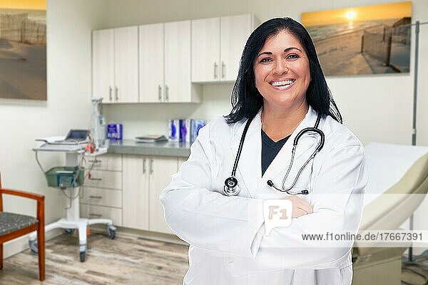 Hispanic female doctor standing in office