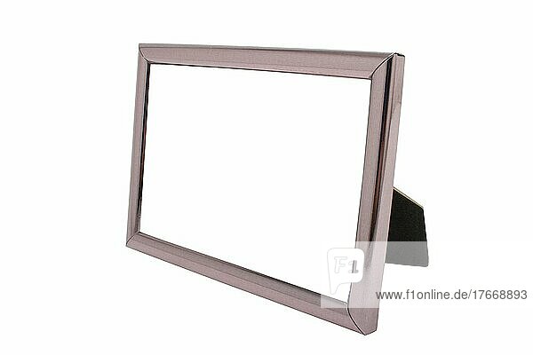Empty metal picture frame before white background
