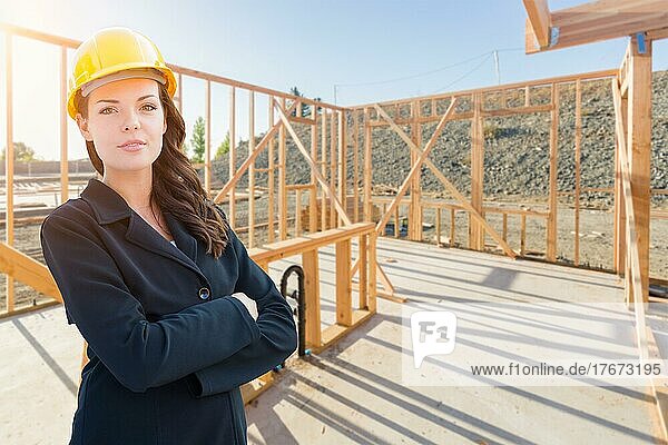 Female contractor in hard hat at construction site