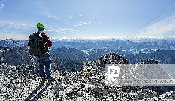 Hiker at the summit of Schaflegg  mountain panorama with rocky ridge and peak Seehorn  Nuaracher Höhenweg  Loferer Steinberge  Tyrol  Austria  Europe