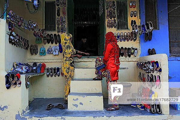 Rajasthan  Mandawa  street scene in the centre of the small town  Indian woman in front of a shoe shop  North India  India  Asia