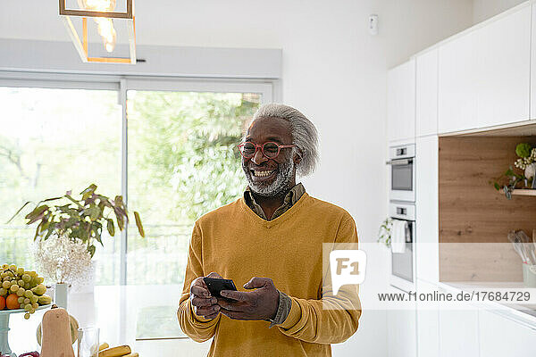 Senior man holding smart phone