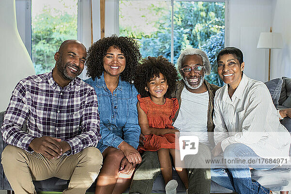 Happy multi-generation family sitting in living room